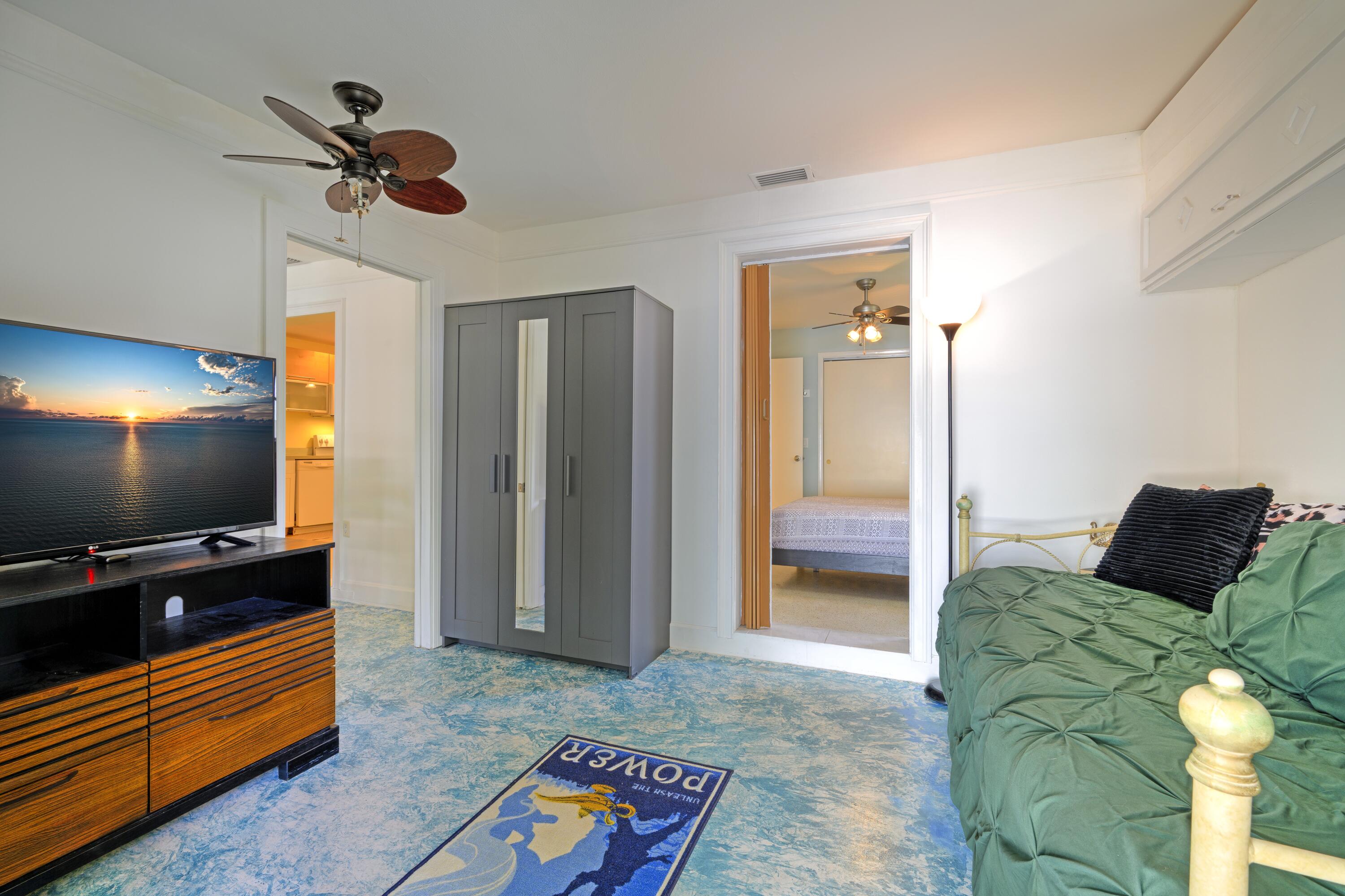 438 Southeast Fini Drive Stuart, FL 34996 - Photo 11 of 21 a living room with furniture and a flat screen tv