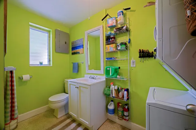 a bathroom with a toilet and a sink