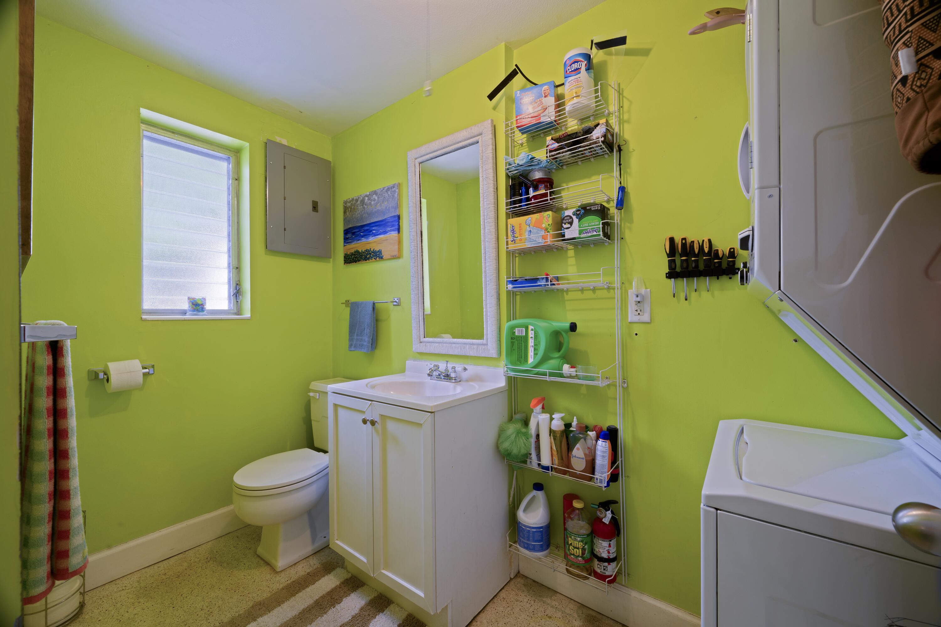 438 Southeast Fini Drive Stuart, FL 34996 - Photo 12 of 21 a bathroom with a toilet and a sink