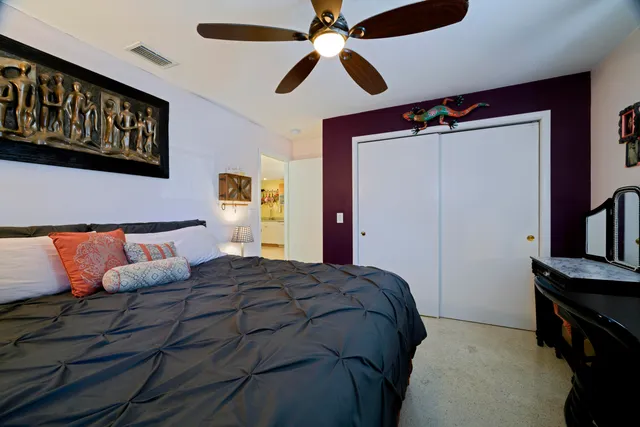 a bedroom with a bed and a walk in closet