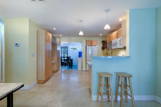 a view of a hallway with seating area