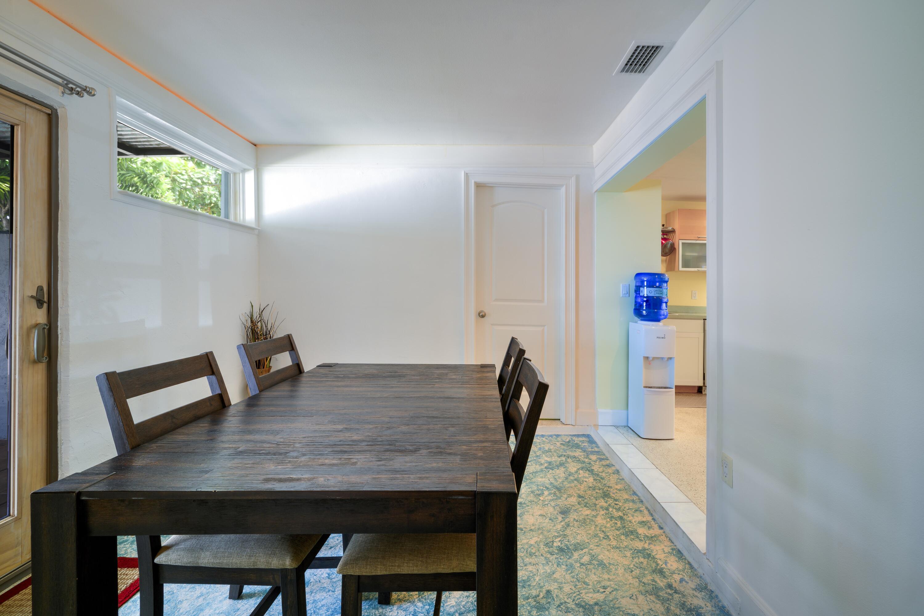 438 Southeast Fini Drive Stuart, FL 34996 - Photo 8 of 21 a view of a dining room with furniture and a window