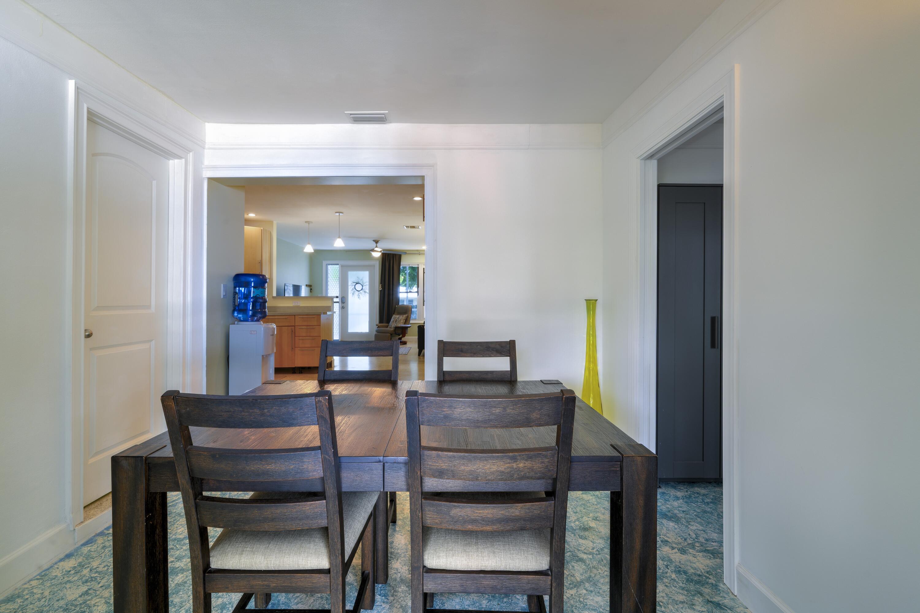 438 Southeast Fini Drive Stuart, FL 34996 - Photo 9 of 21 a dining room with furniture and wooden floor