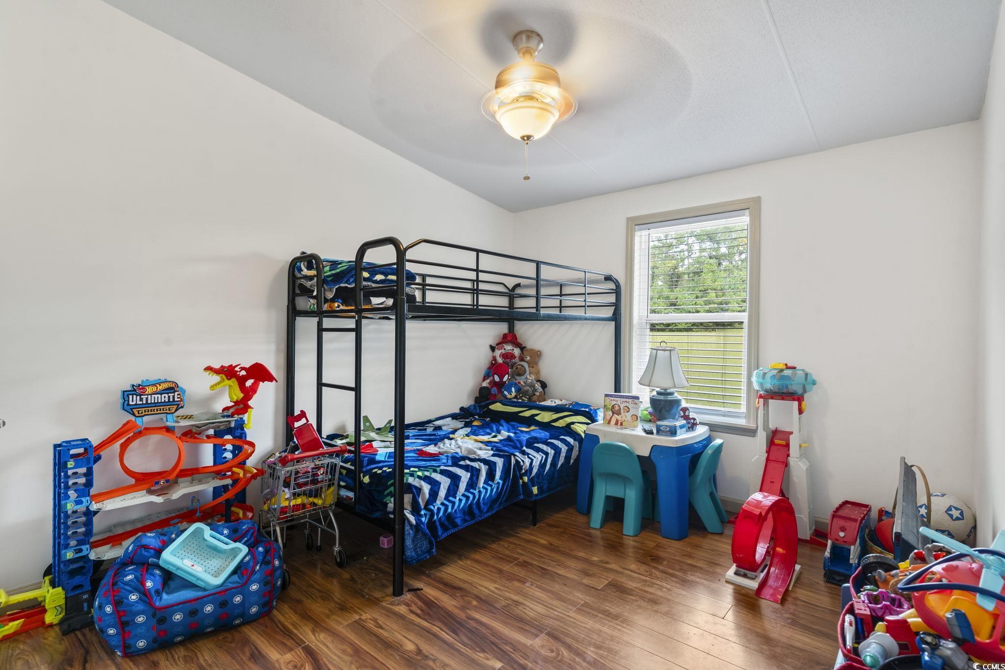 1585 Daisy Road Loris, SC 29569 - Photo 33 of 39 Bedroom with dark wood-style floors and a ceiling fan
