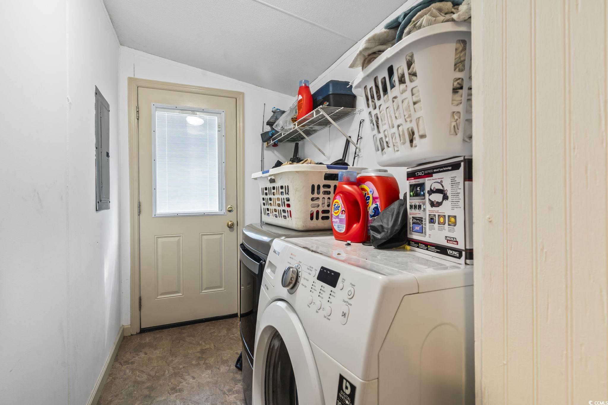 1585 Daisy Road Loris, SC 29569 - Photo 35 of 39 Washroom with separate washer and dryer, stone finish flooring, and electric panel