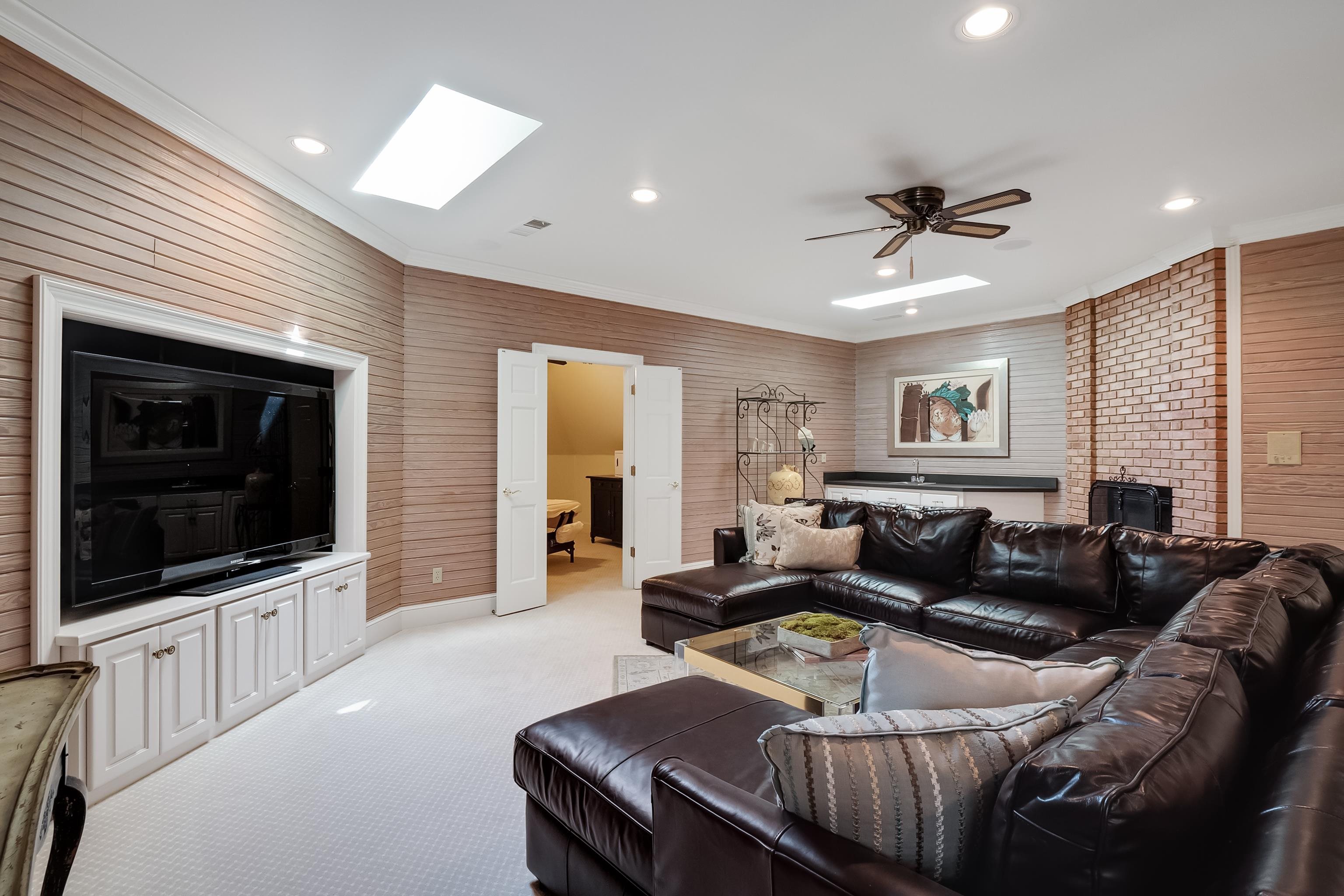 3044 Shea Road Collierville, TN 38017 - Photo 25 of 40 a living room with furniture and a flat screen tv