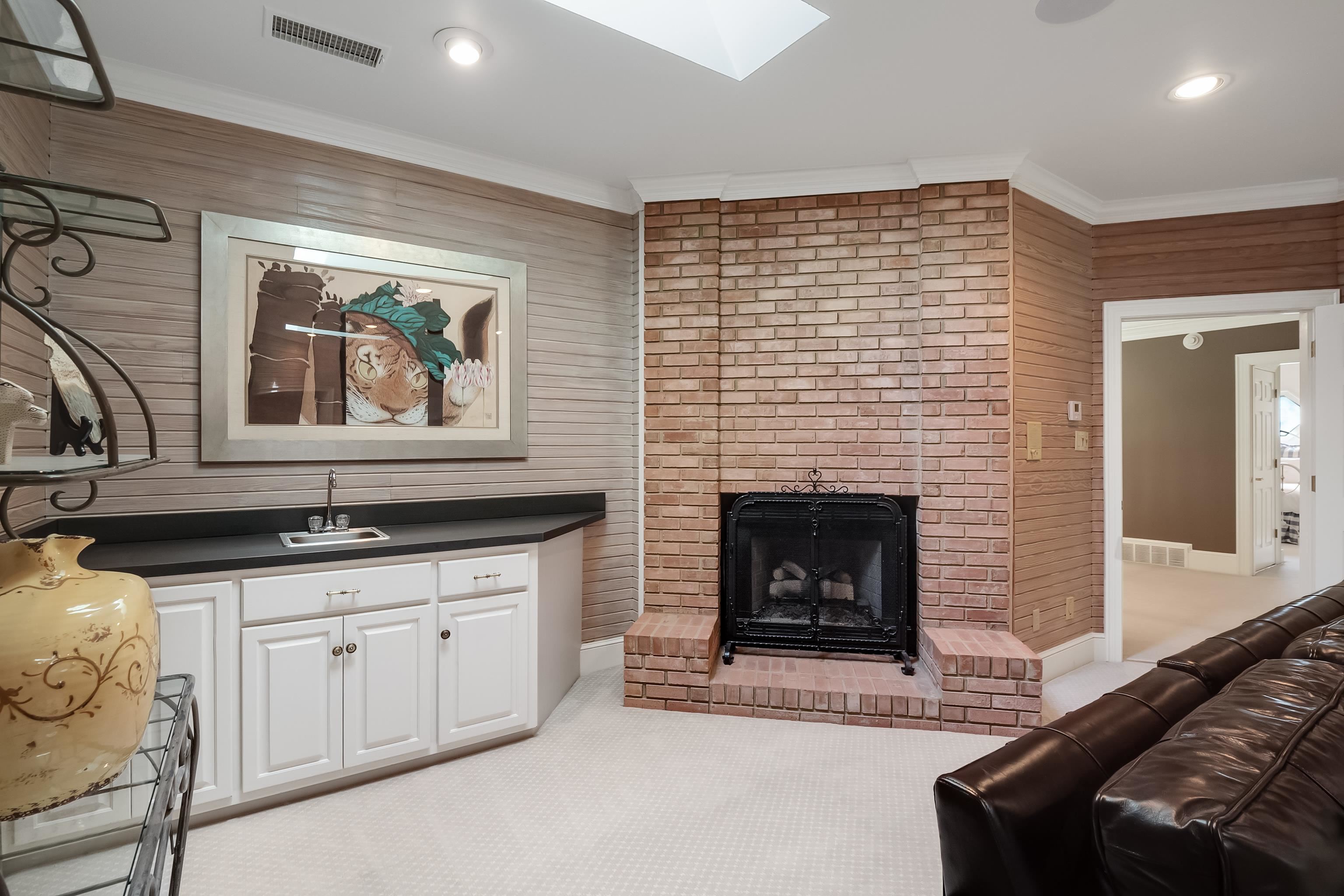 3044 Shea Road Collierville, TN 38017 - Photo 26 of 40 a living room with stainless steel appliances granite countertop furniture a fireplace and a window