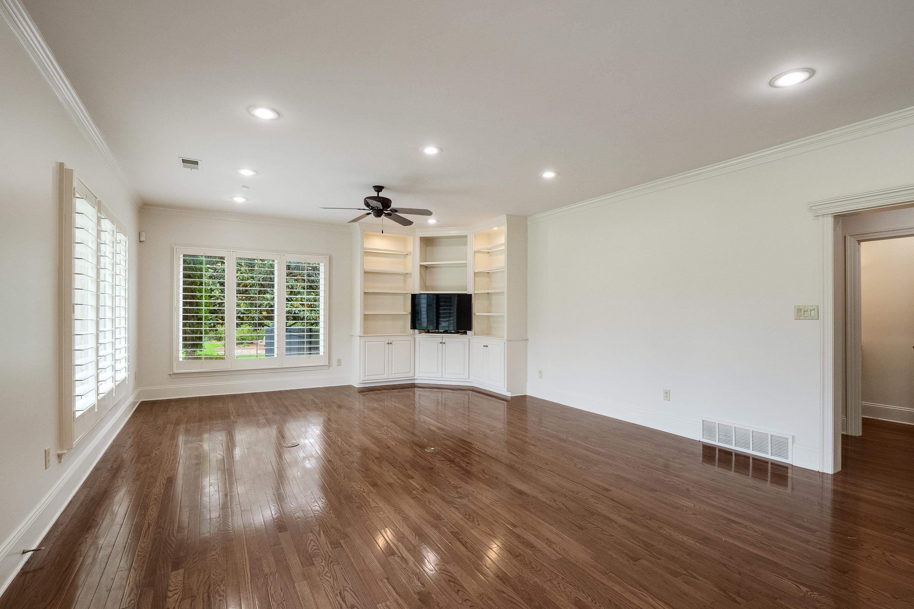3044 Shea Road Collierville, TN 38017 - Photo 30 of 40 a view of an empty room with wooden floor and a window