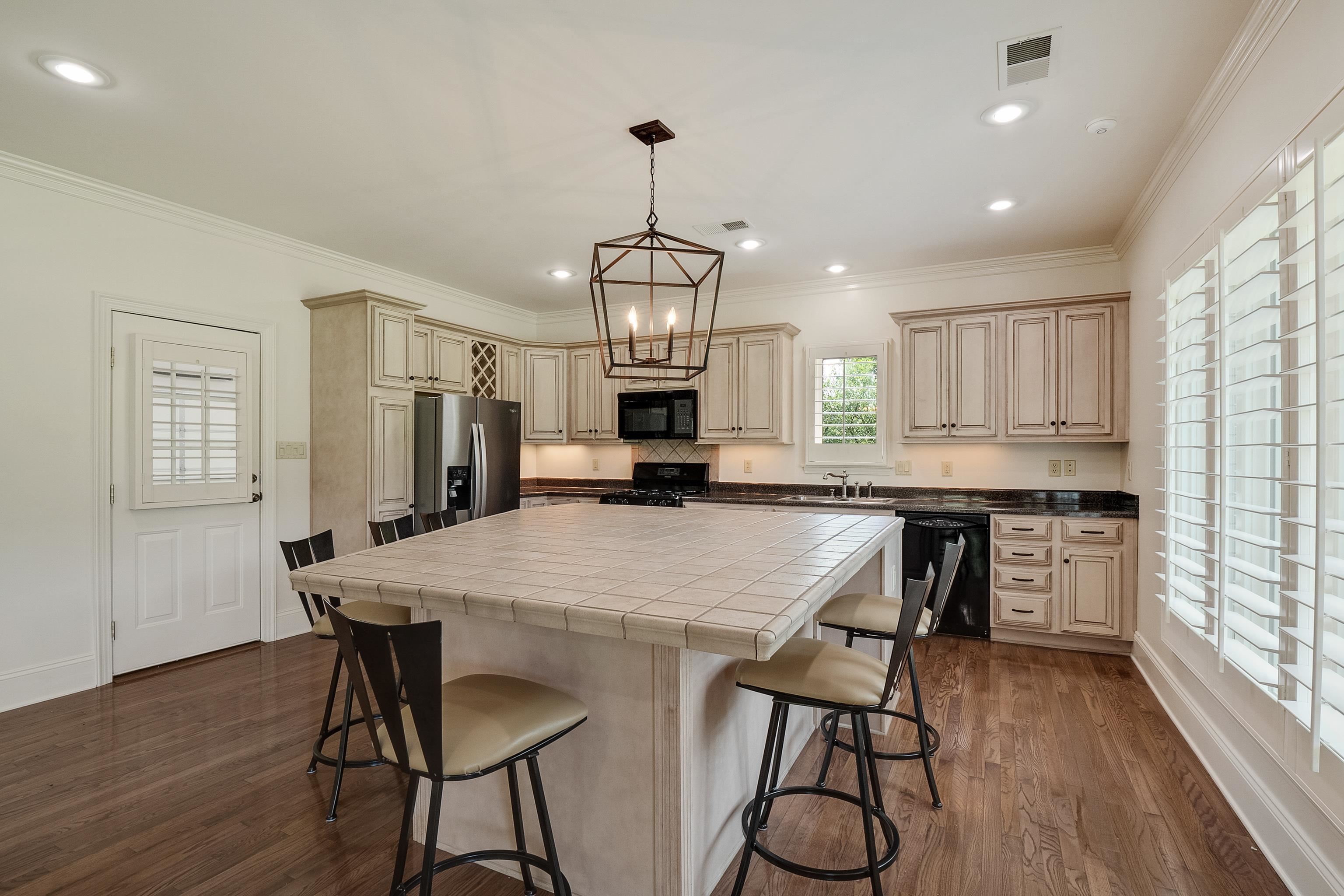 3044 Shea Road Collierville, TN 38017 - Photo 31 of 40 a view of a a dining room with furniture window and wooden floor