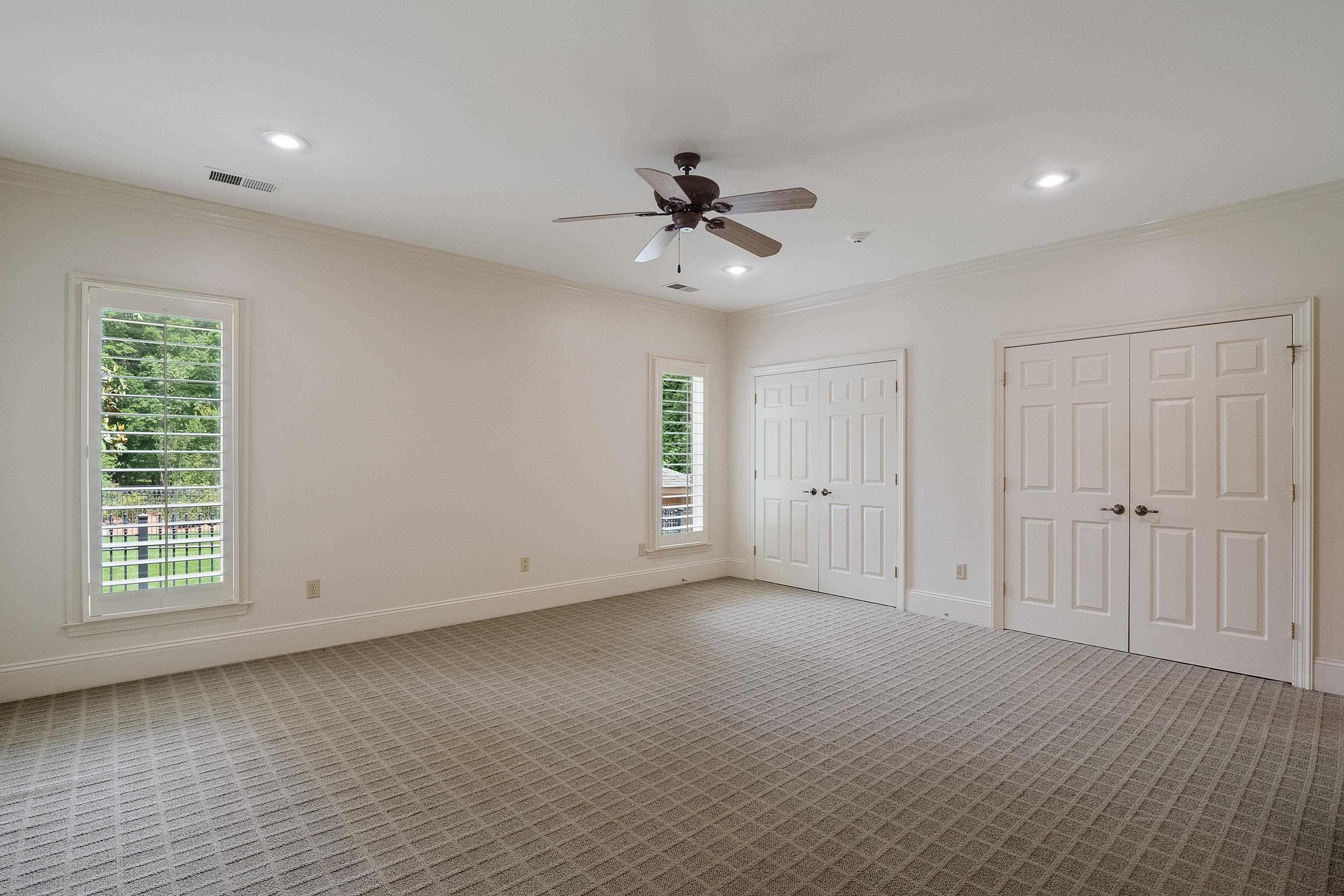 3044 Shea Road Collierville, TN 38017 - Photo 32 of 40 an empty room with windows and fan