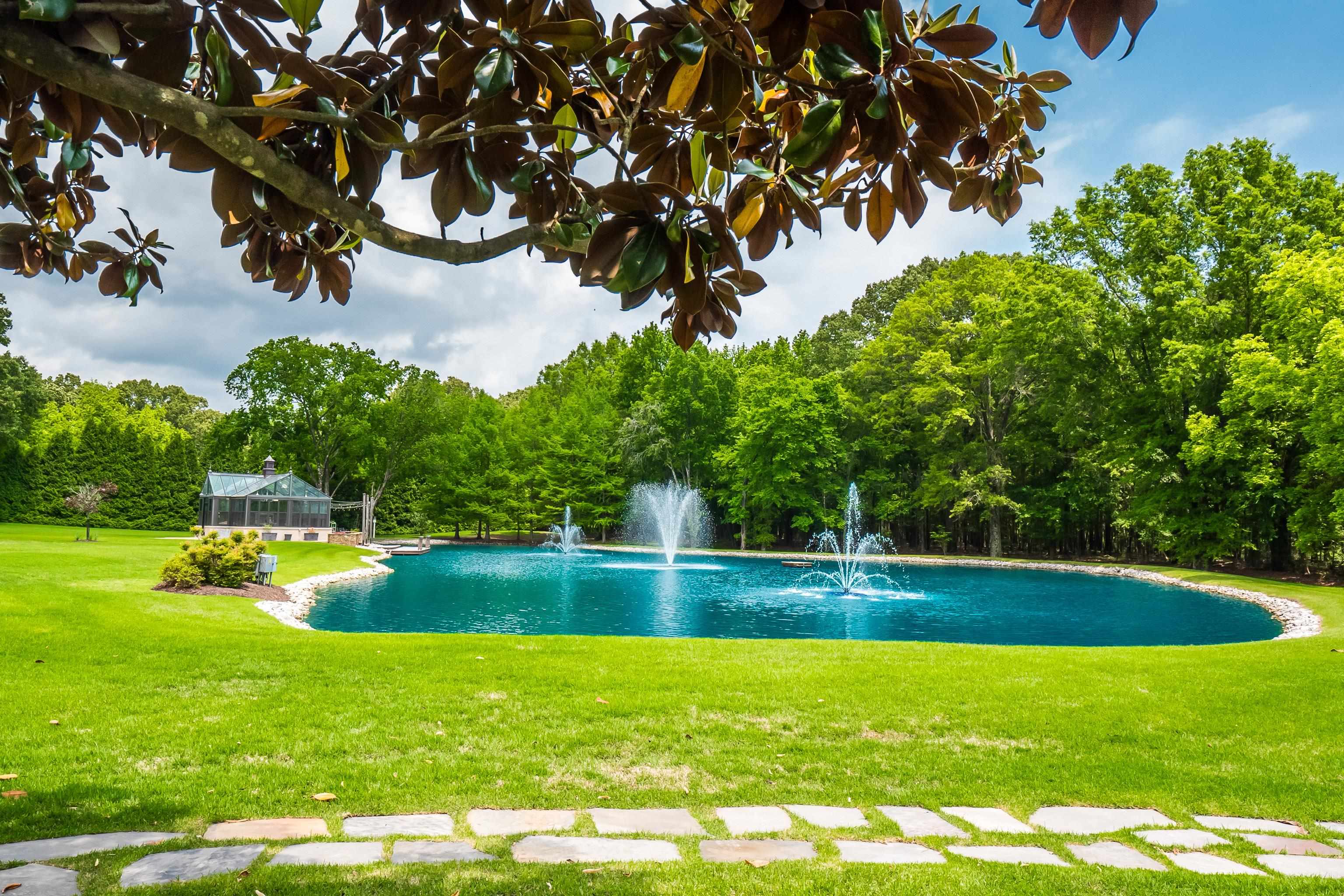 3044 Shea Road Collierville, TN 38017 - Photo 33 of 40 a view of a swimming pool and a yard