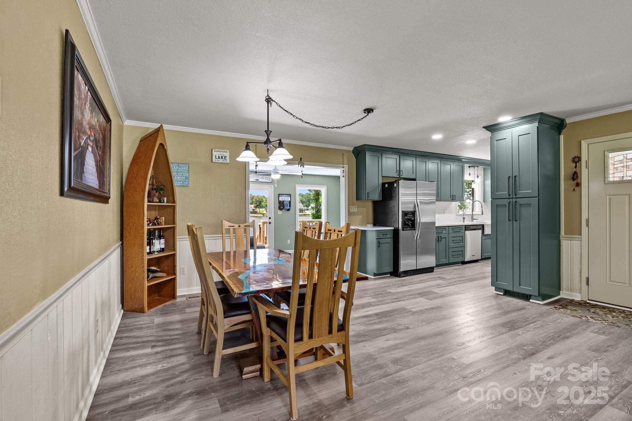 1017 Holloway Church Road Lexington, NC 27292 - Photo 14 of 48 a view of a dining room with furniture and wooden floor