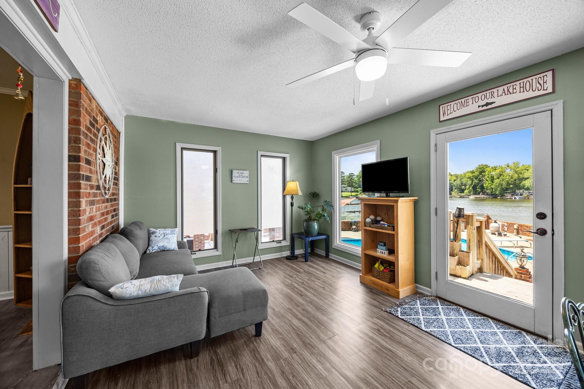1017 Holloway Church Road Lexington, NC 27292 - Photo 21 of 48 a living room with furniture and a flat screen tv