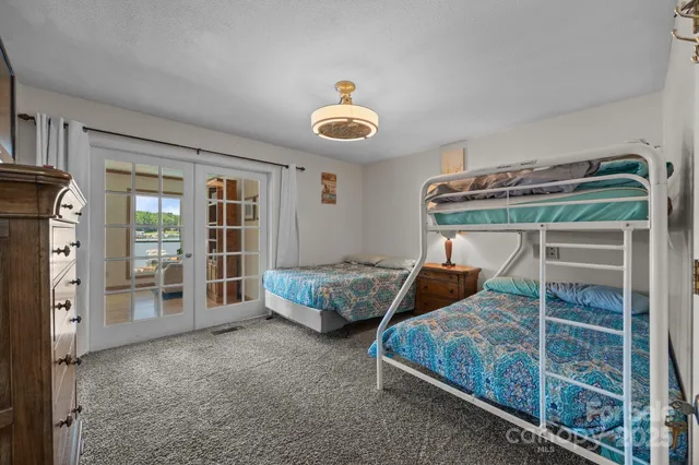 a bedroom with bed and a window