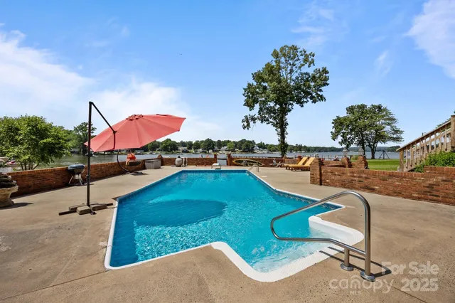 an aerial view of a house having swimming pool