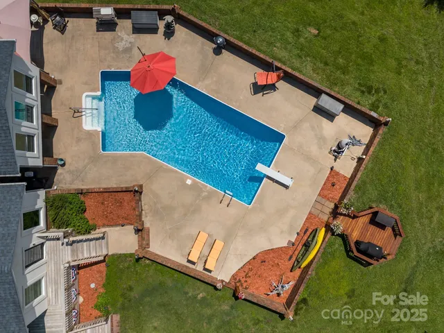a view of a lake with couches in front of house