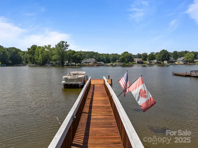 an aerial view of a house with a lake view