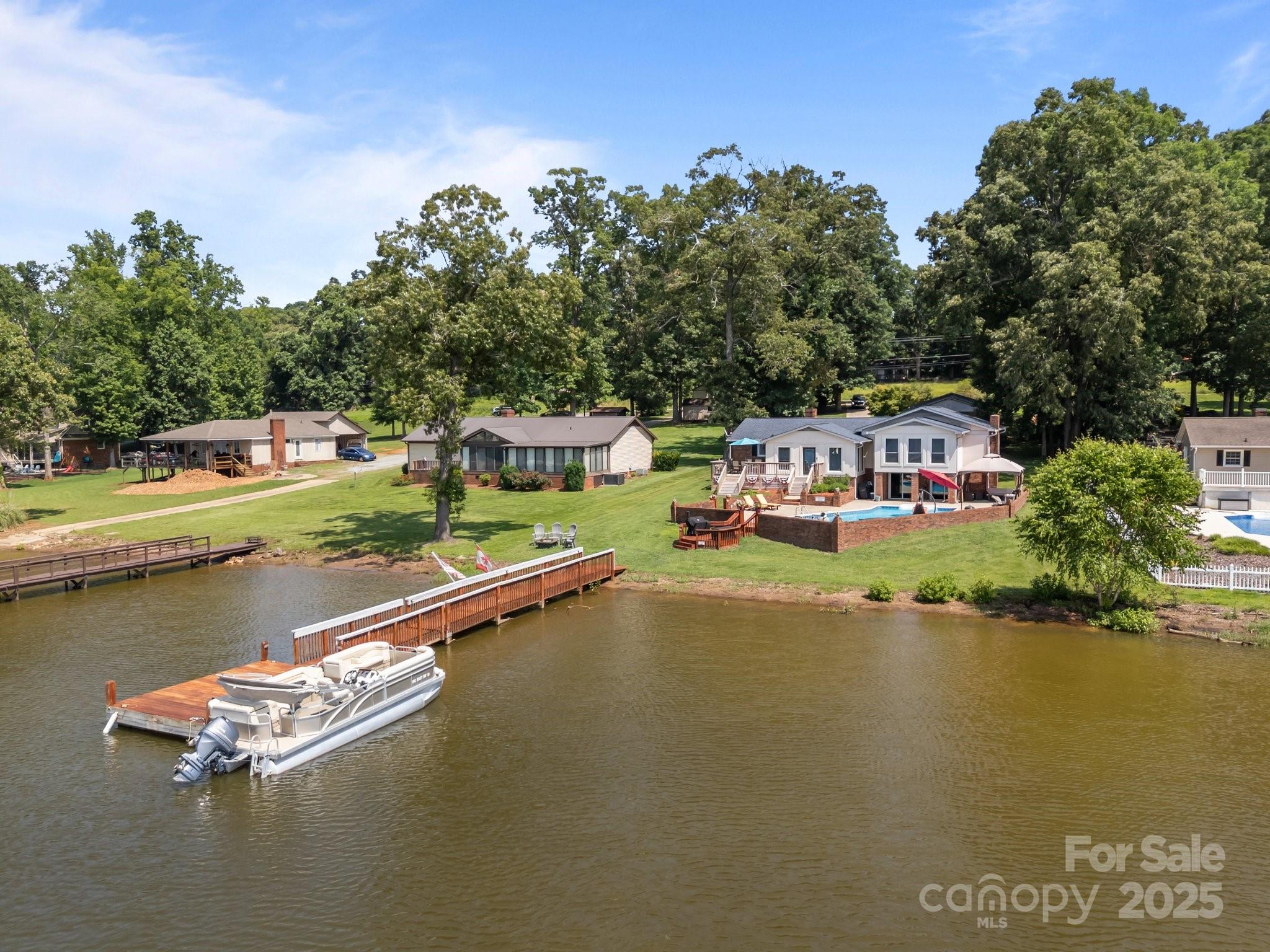 1017 Holloway Church Road Lexington, NC 27292 - Photo 43 of 48 a view of swimming pool with outdoor seating and lake view