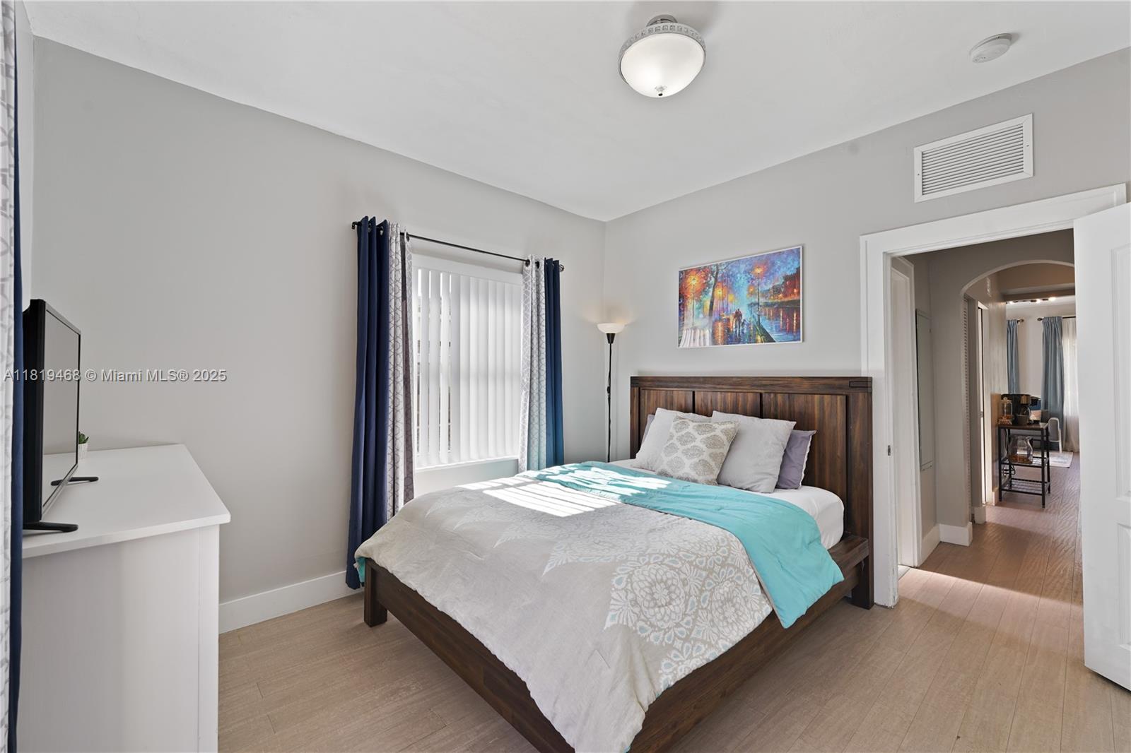 1753 Southwest 13th Street, Unit 1 Miami, FL 33145 - Photo 12 of 13 a bedroom with a bed and a window