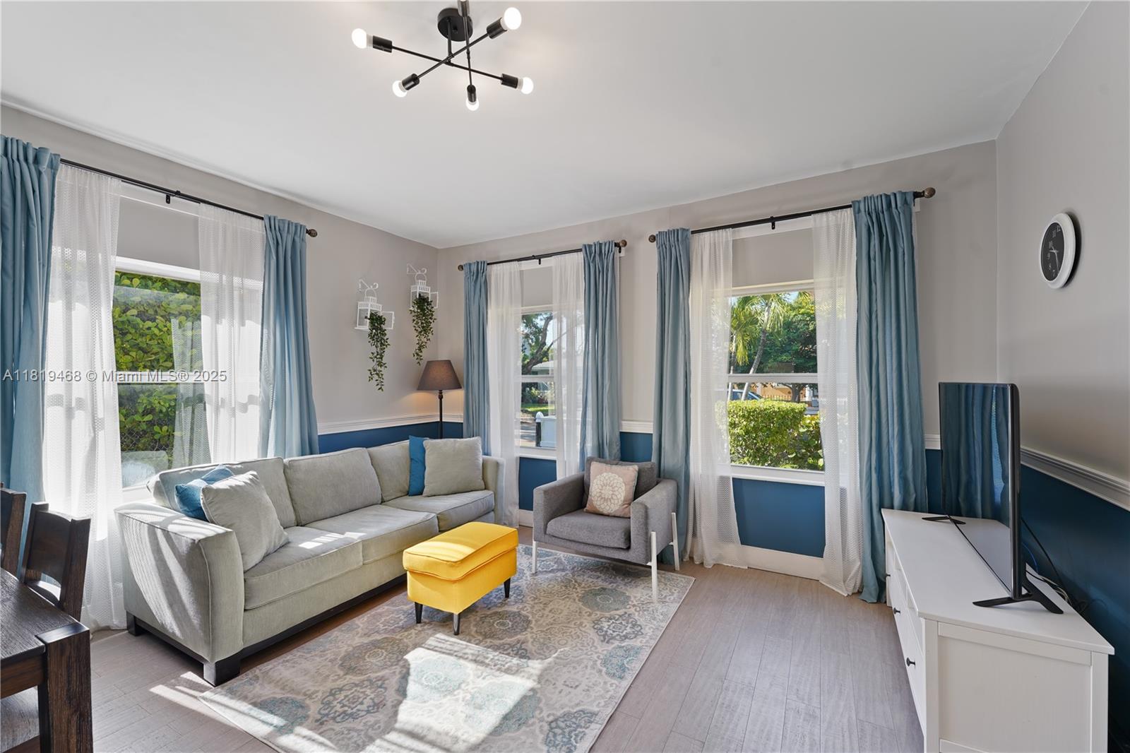 1753 Southwest 13th Street, Unit 1 Miami, FL 33145 - Photo 5 of 13 a living room with furniture and a window