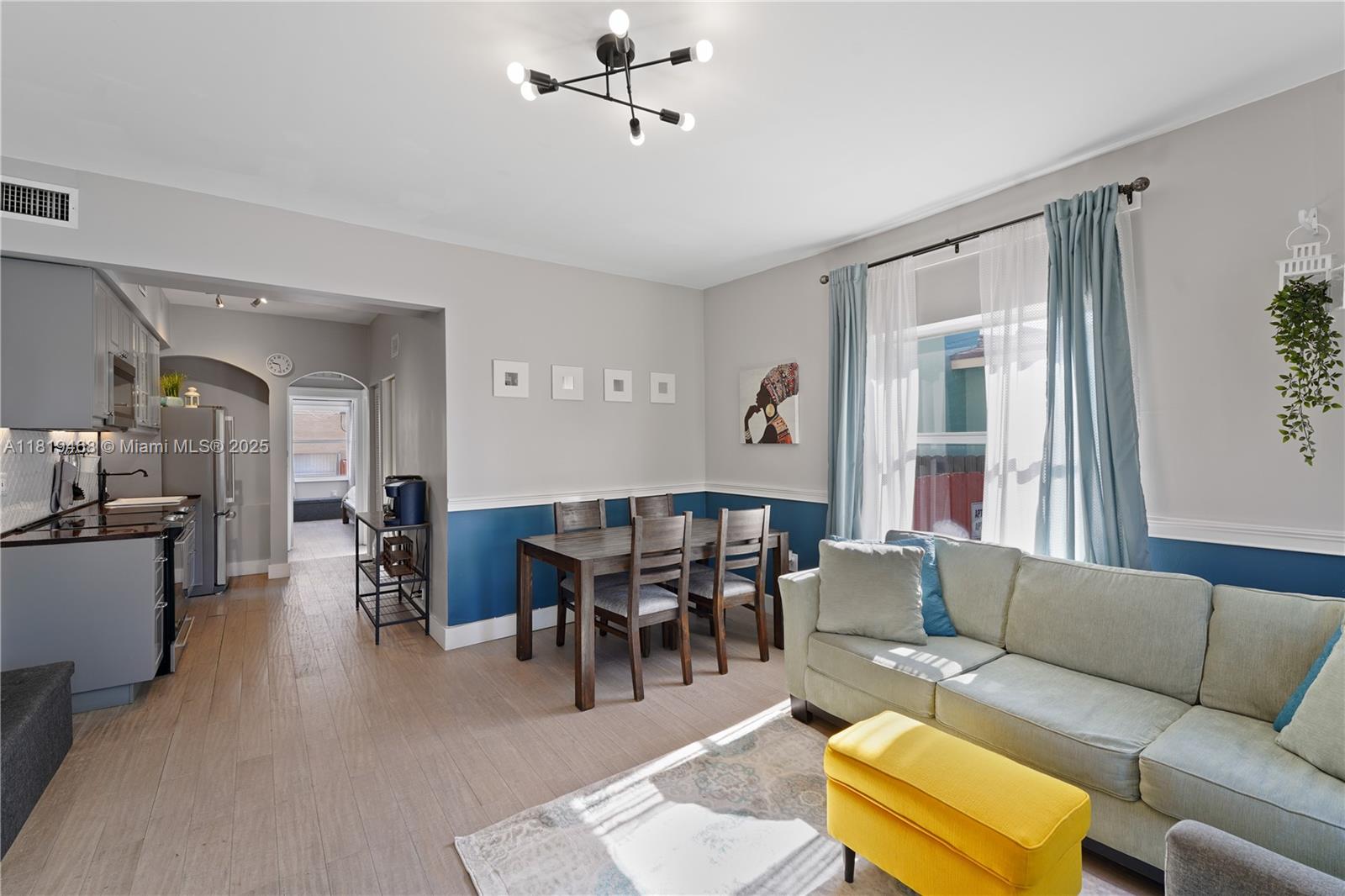 1753 Southwest 13th Street, Unit 1 Miami, FL 33145 - Photo 6 of 13 a living room with furniture a ceiling fan and a window
