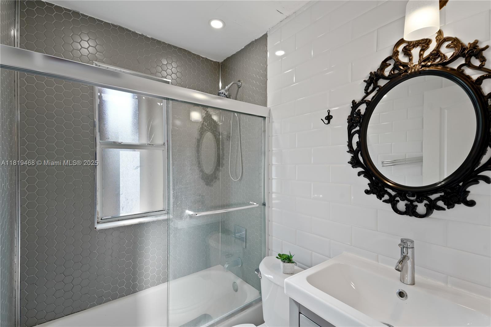 1753 Southwest 13th Street, Unit 1 Miami, FL 33145 - Photo 10 of 13 a bathroom with a sink and a mirror