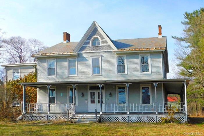 a front view of a house with swimming pool