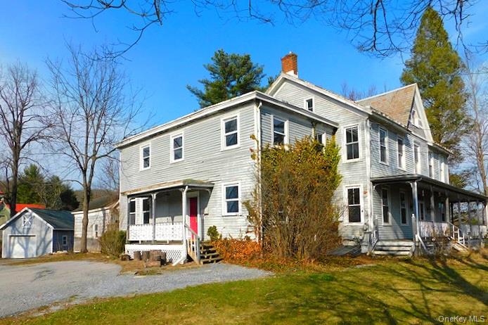 853 Salt Point Turnpike Poughkeepsie, NY 12601 - Photo 2 of 25 a front view of a house with a yard outdoor seating and garage