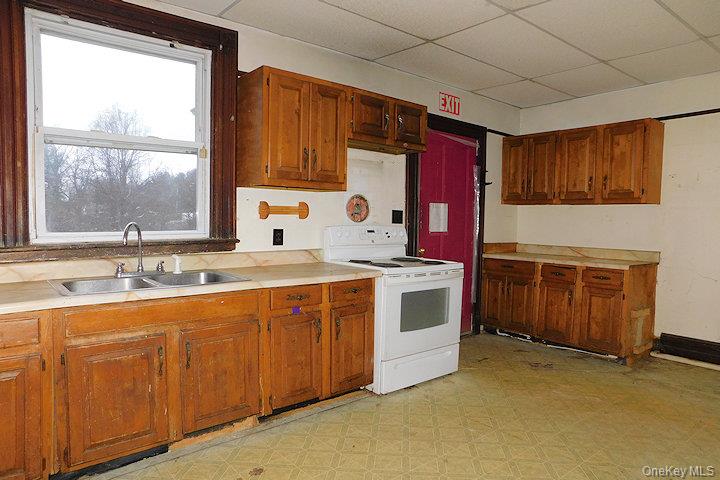 853 Salt Point Turnpike Poughkeepsie, NY 12601 - Photo 5 of 25 a kitchen with a sink stove and cabinets
