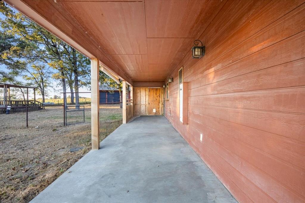 1809 County Road Winnsboro, TX 75494 - Photo 21 of 39 a view of a pathway of a house