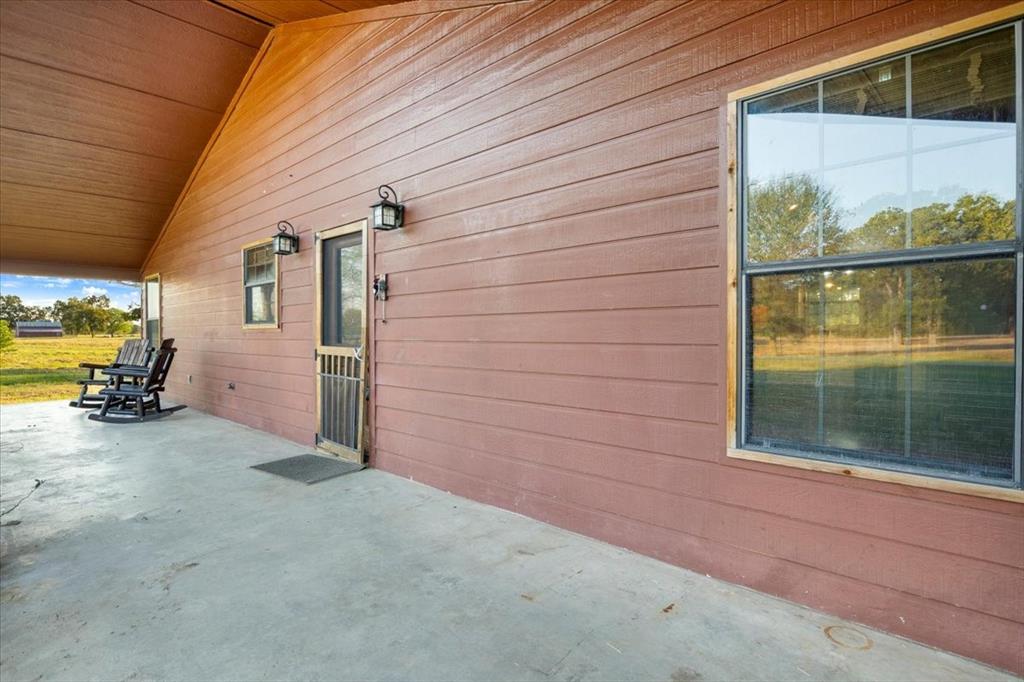1809 County Road Winnsboro, TX 75494 - Photo 3 of 39 a view of a house with a backyard