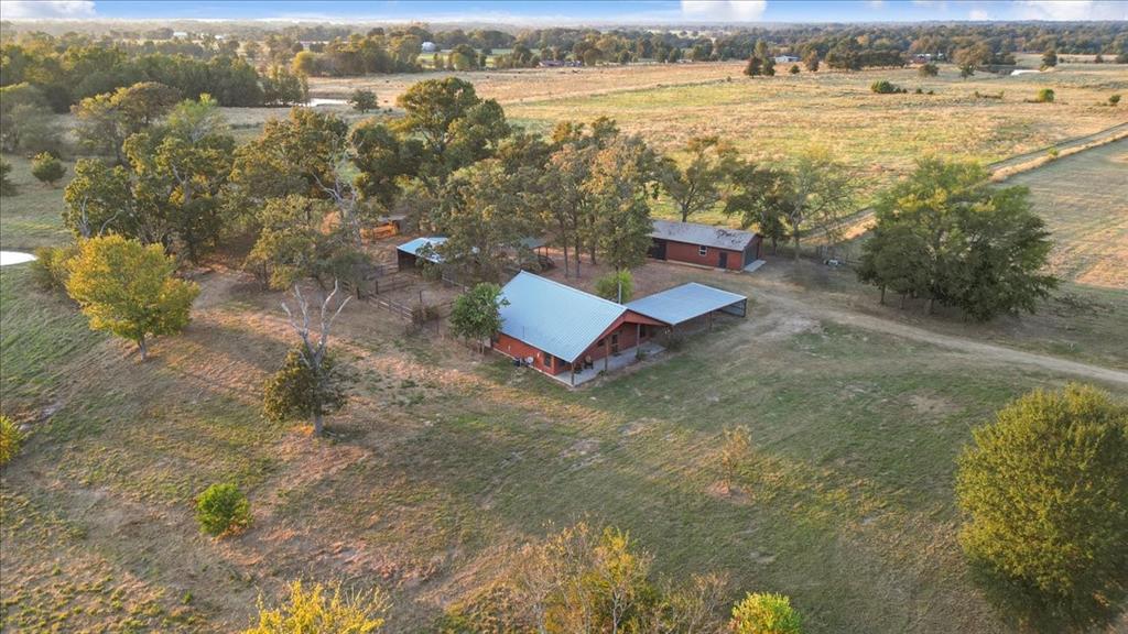 1809 County Road Winnsboro, TX 75494 - Photo 34 of 39 an aerial view of residential houses with outdoor space and swimming pool