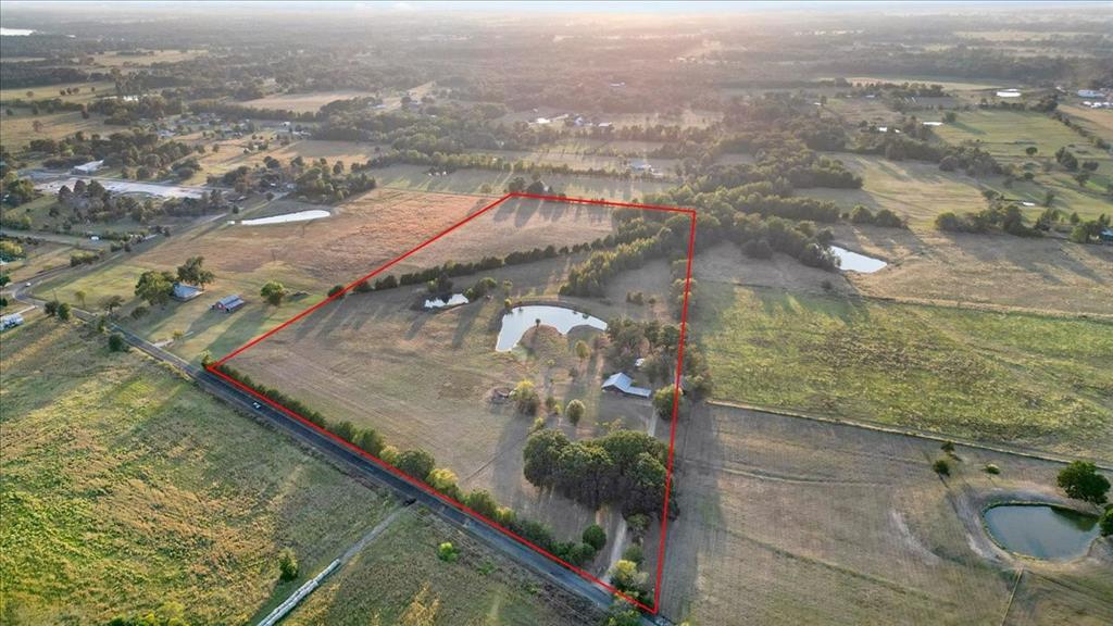 1809 County Road Winnsboro, TX 75494 - Photo 35 of 39 an aerial view of residential houses with outdoor space