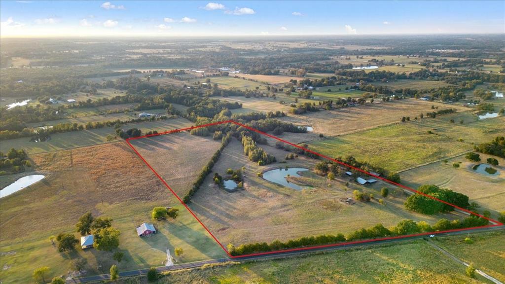 1809 County Road Winnsboro, TX 75494 - Photo 36 of 39 an aerial view of residential houses with outdoor space