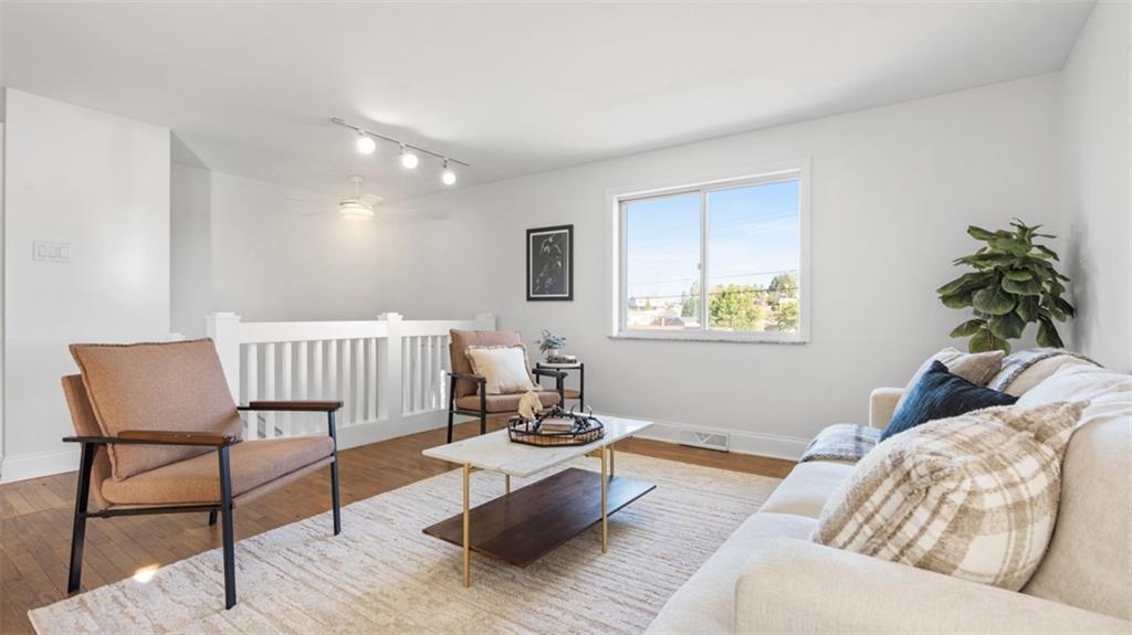 161 Warrencliff Drive Monaca, PA 15061 - Photo 12 of 40 a living room with furniture and a wooden floor