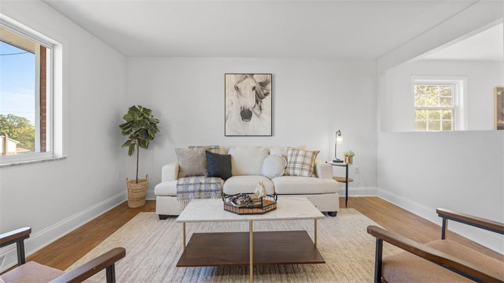161 Warrencliff Drive Monaca, PA 15061 - Photo 16 of 40 a living room with furniture a potted plant and a window