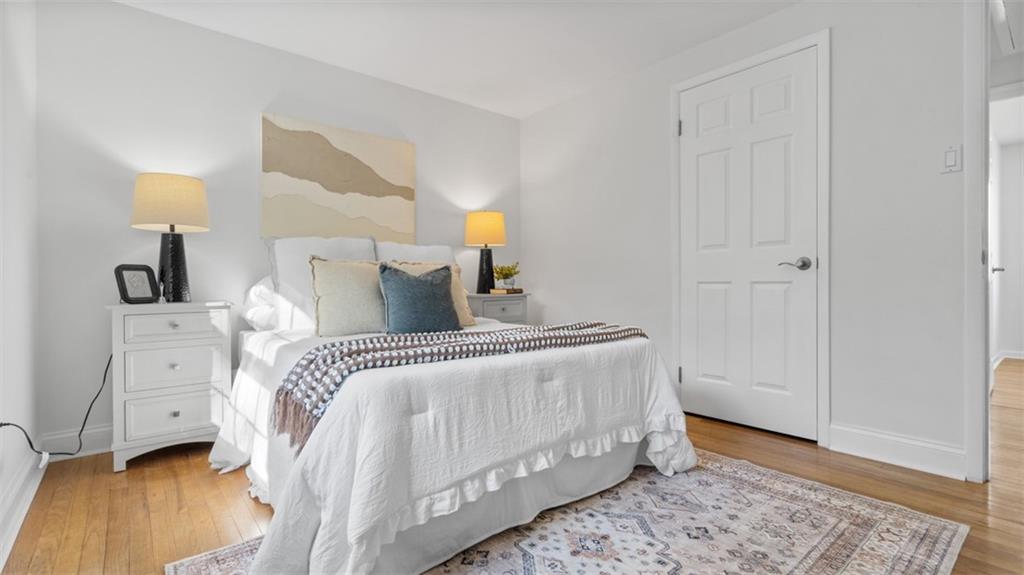 161 Warrencliff Drive Monaca, PA 15061 - Photo 2 of 40 a bedroom with a bed and a lamp