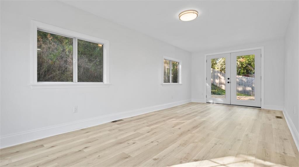161 Warrencliff Drive Monaca, PA 15061 - Photo 22 of 40 a view of an empty room with a window and wooden floor