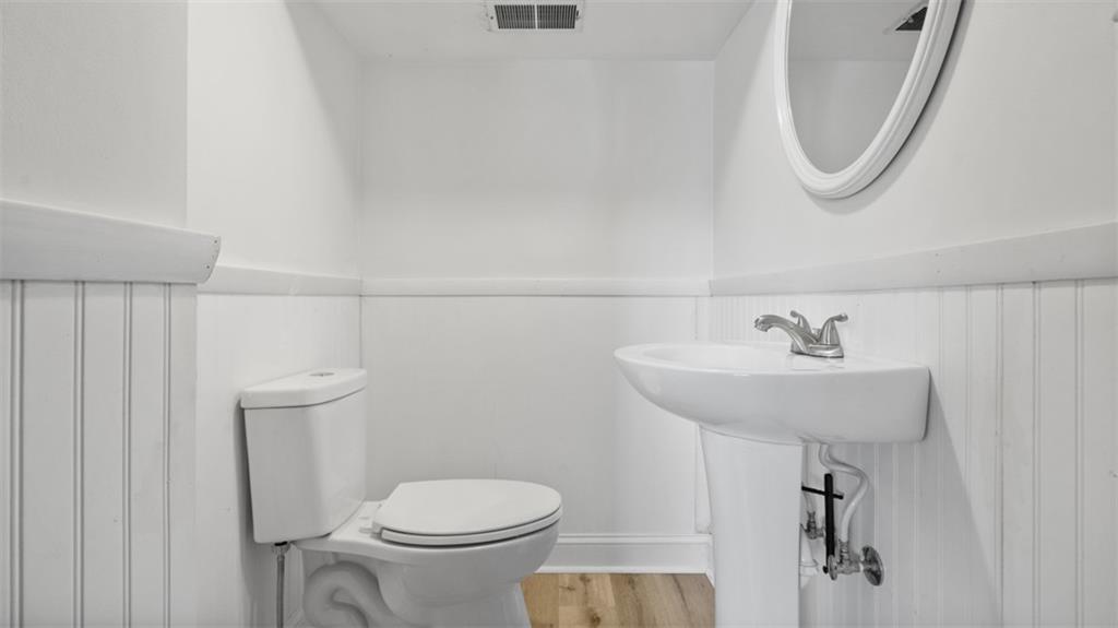 161 Warrencliff Drive Monaca, PA 15061 - Photo 29 of 40 a bathroom with a sink a toilet and a mirror