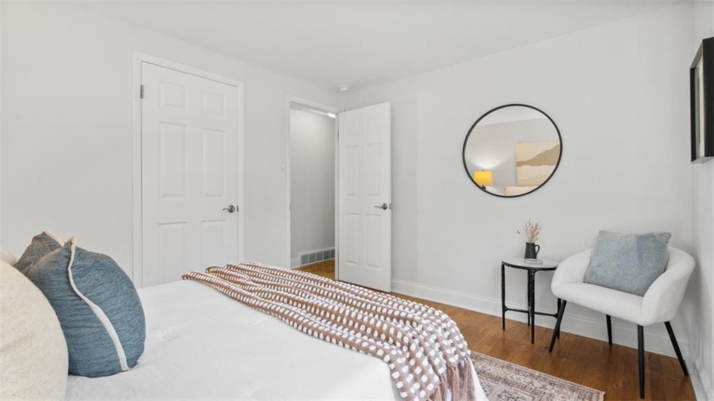 161 Warrencliff Drive Monaca, PA 15061 - Photo 3 of 40 a bedroom with a bed and a chair