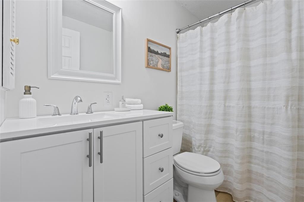 161 Warrencliff Drive Monaca, PA 15061 - Photo 4 of 40 a bathroom with a toilet sink and mirror