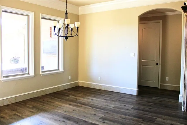 a bathroom with a granite countertop sink and a window