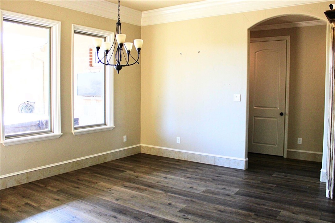 100 Deer Creek Drive Waco, TX 76708 - Photo 13 of 26 a view of a room with wooden floor and door