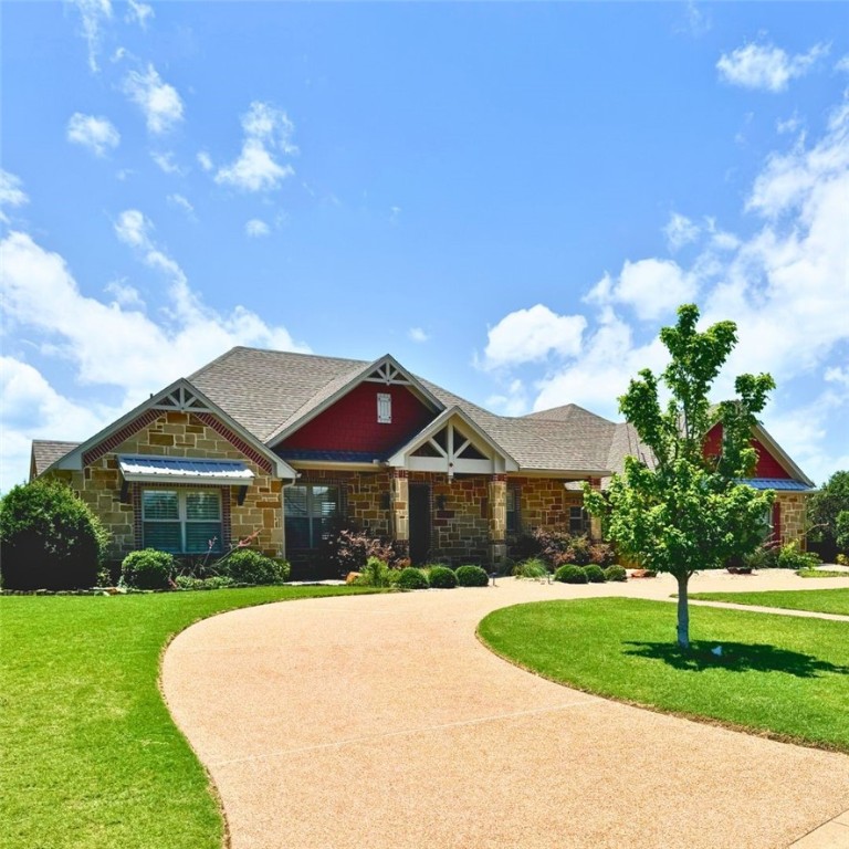 100 Deer Creek Drive Waco, TX 76708 - Photo 2 of 26 a front view of a house with garden