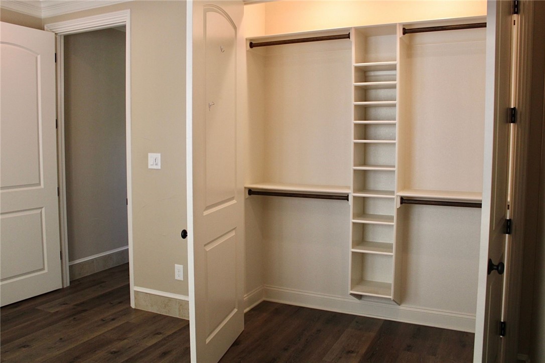 100 Deer Creek Drive Waco, TX 76708 - Photo 25 of 26 a view of walk in closet with empty racks