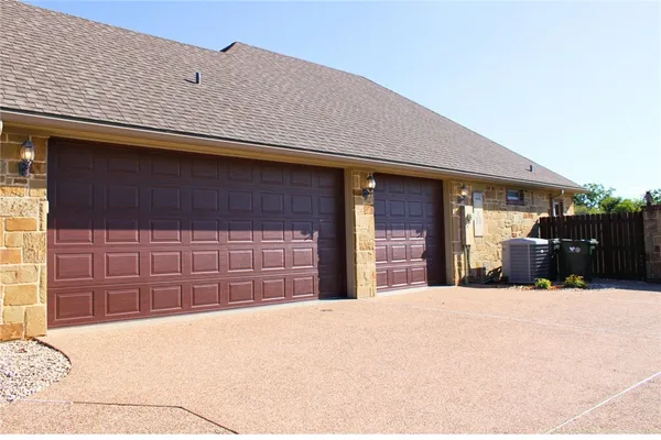 a front view of a house with a garage