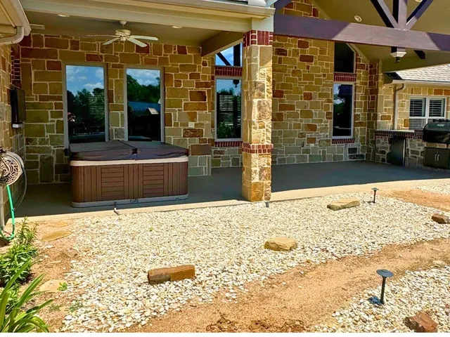 an aerial view of a house with swimming pool