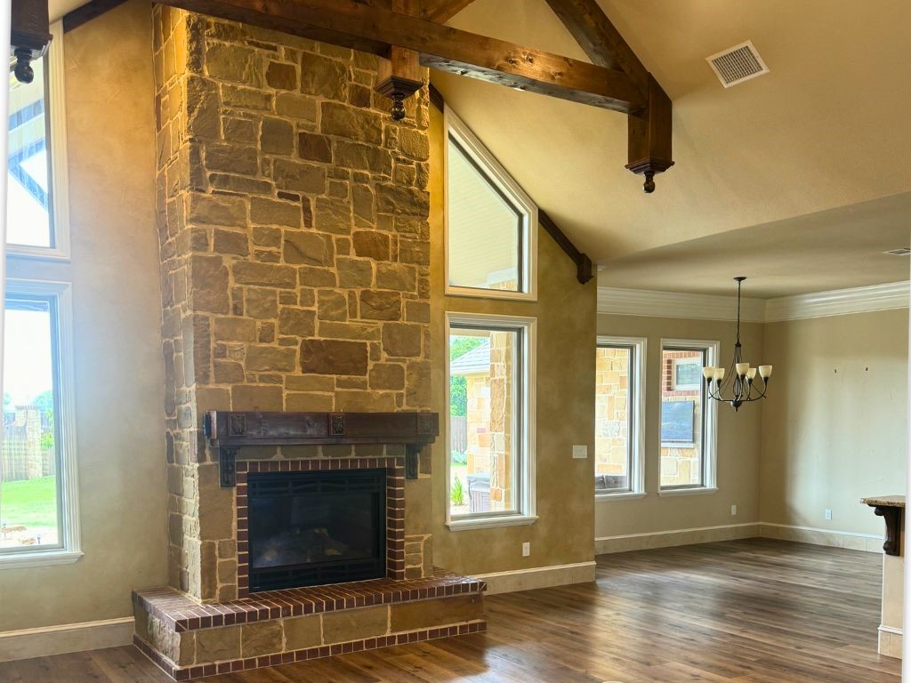 100 Deer Creek Drive Waco, TX 76708 - Photo 9 of 26 a living room with a fireplace and wooden floor