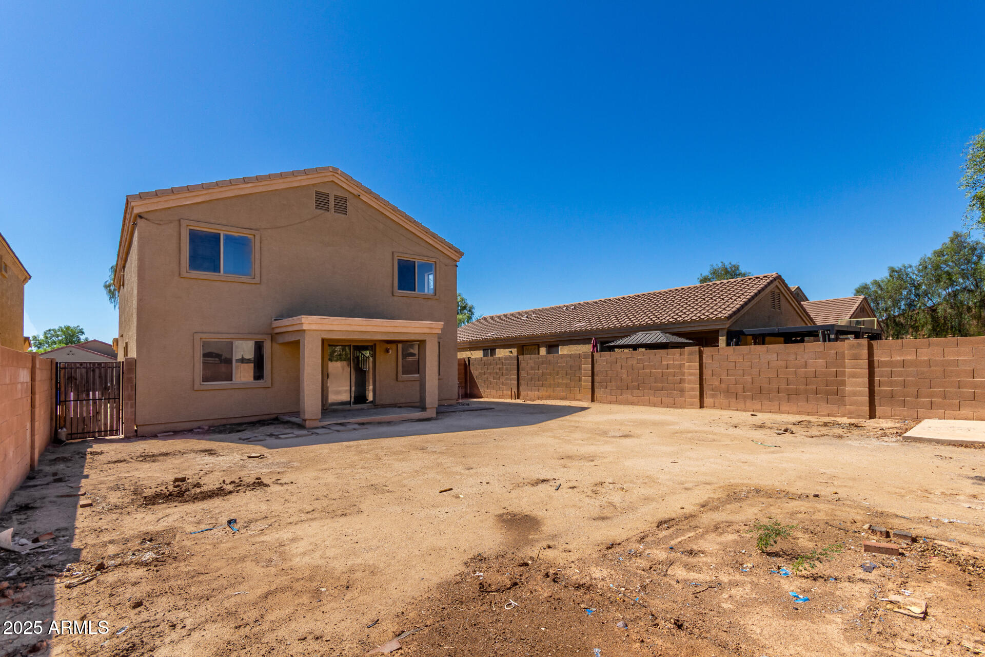 44014 West Magnolia Road Maricopa, AZ 85138 - Photo 16 of 18 a house with trees in front of it