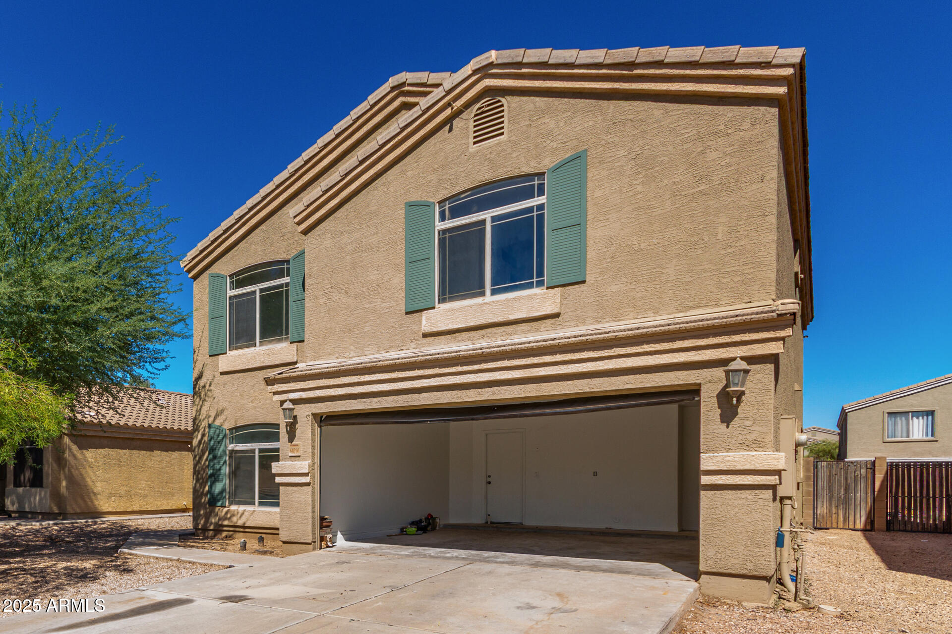 44014 West Magnolia Road Maricopa, AZ 85138 - Photo 3 of 18 a front view of a house with a garage
